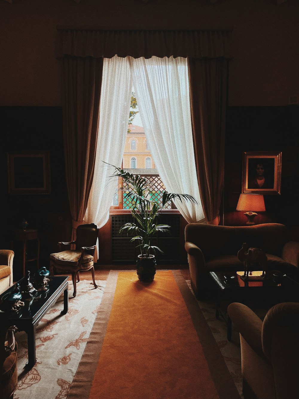 a living room filled with furniture and a large window