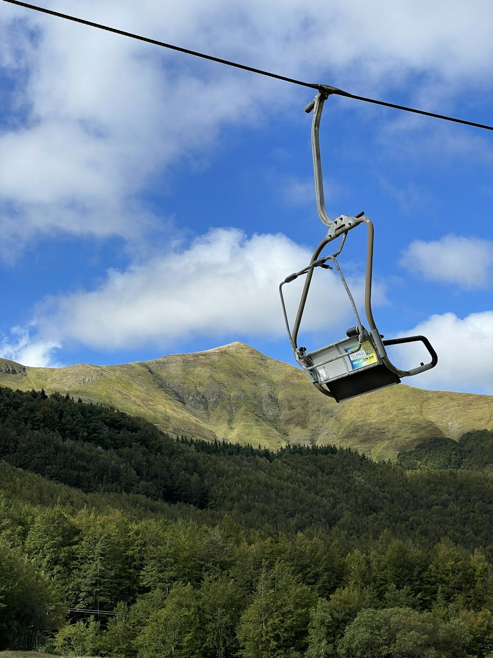 a ski lift going up the side of a mountain