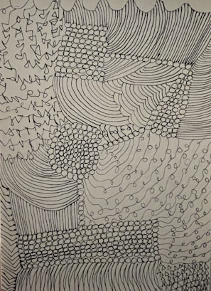 Complex abstract design comprised of various patterns including lines, dots, and curves. The intricacies form a textured patchwork with areas of dense dot clusters and flowing linear sections.