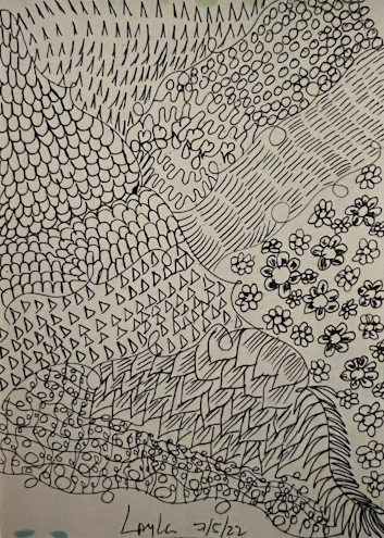 Close-up of a detailed ink drawing with fine lines on textured paper