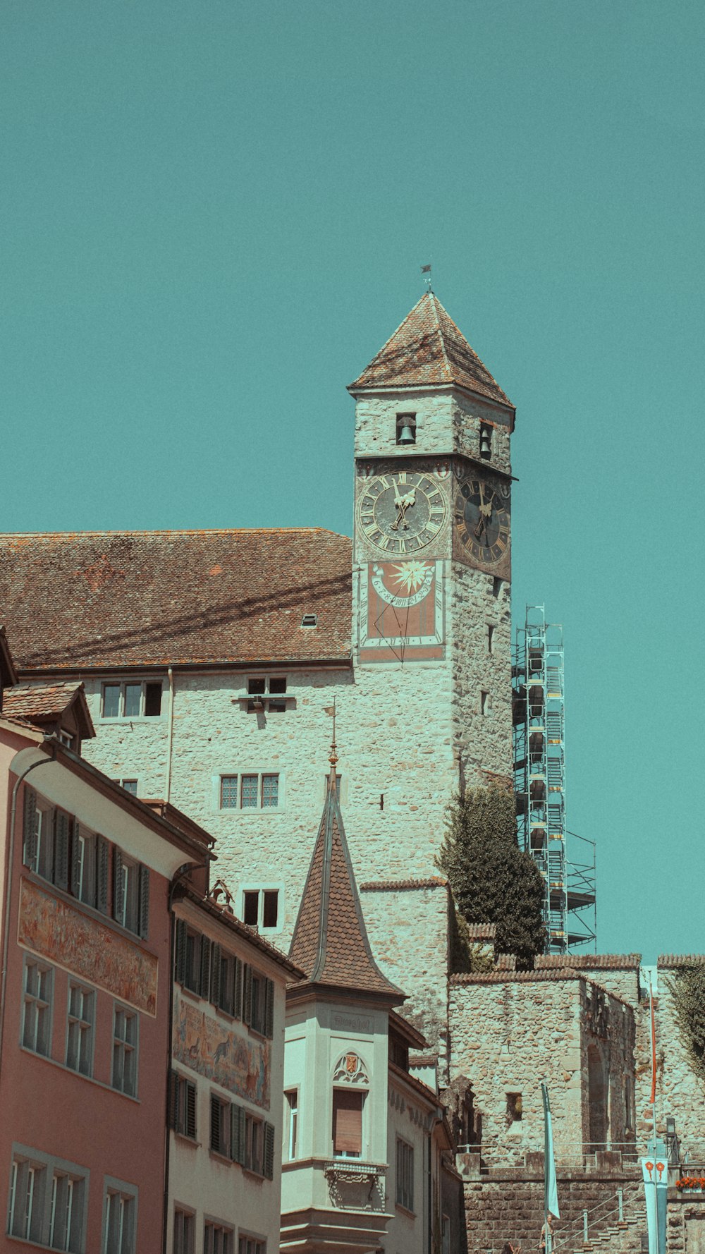 a tall clock tower towering over a city