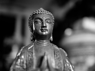 Close-up of a finely detailed 3D printed Catholic saint statue with hand-painted features.