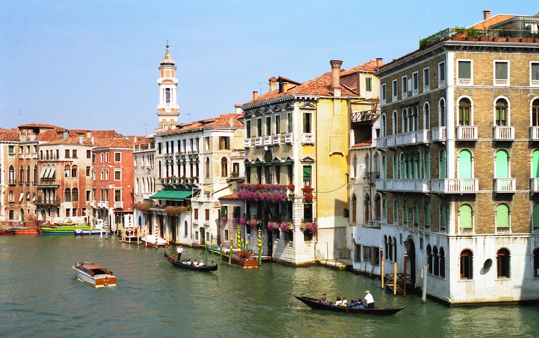 a canal with several buildings and boats in the water,