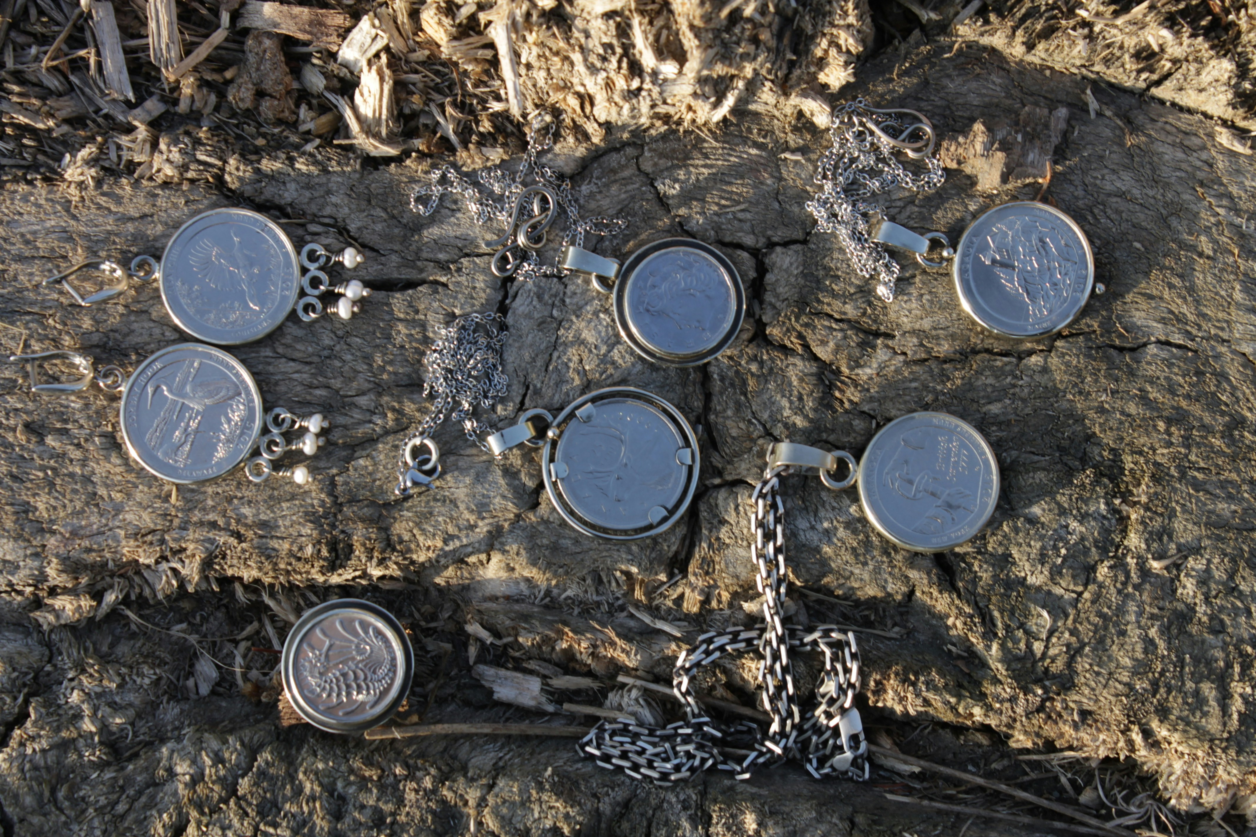 a group of metal containers sitting on top of a rock