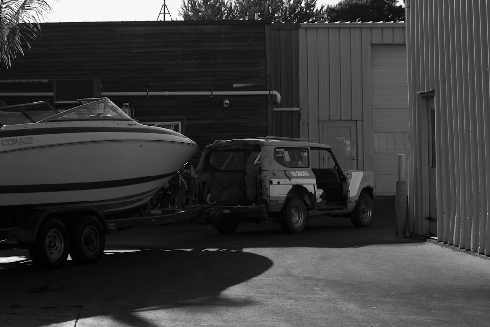 a boat is being towed by a truck