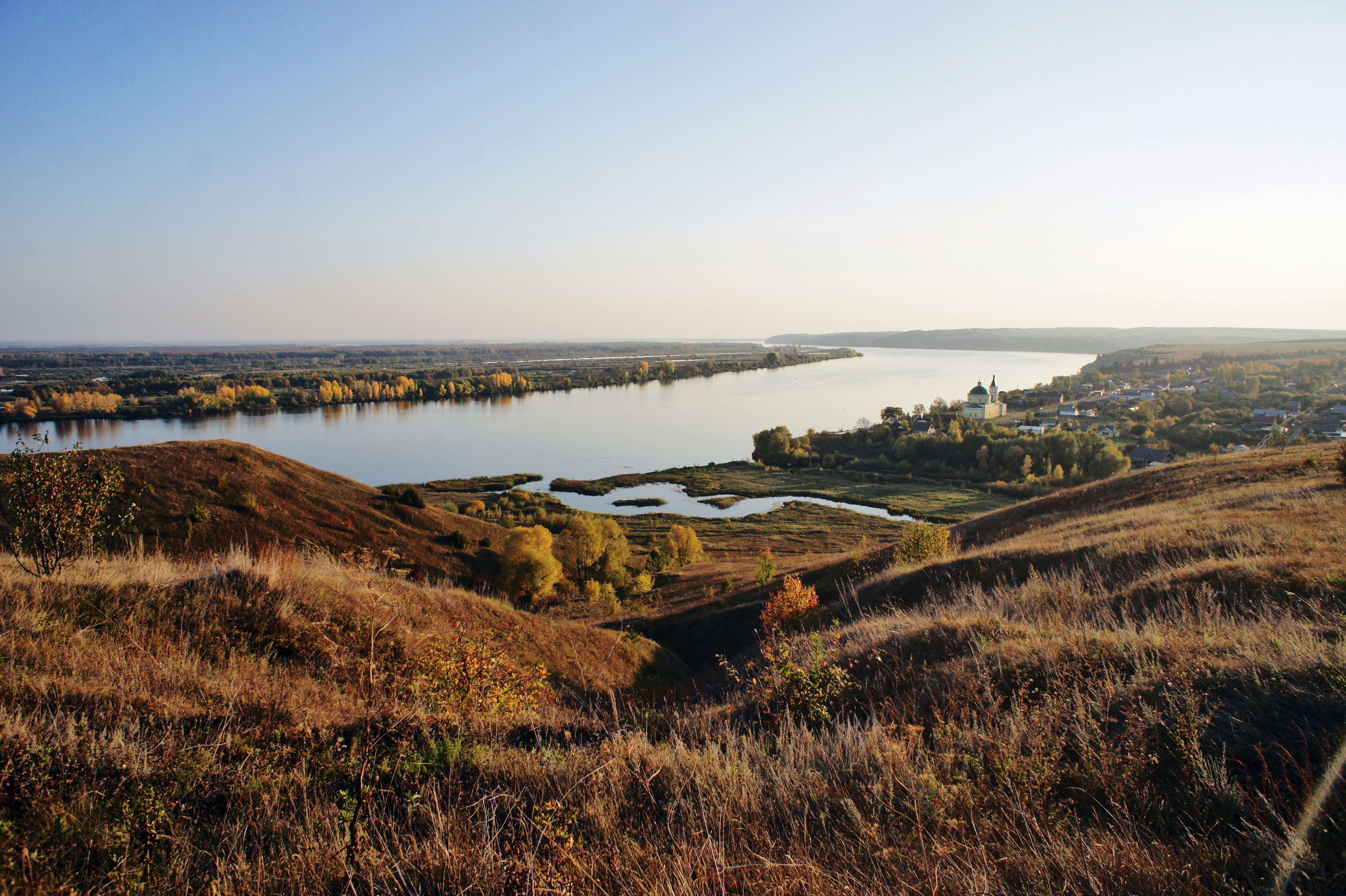a view of a body of water from a hill