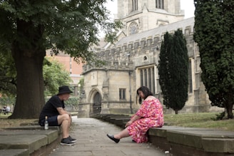 A mentor and a recovering individual sharing a heartfelt conversation on a park bench.