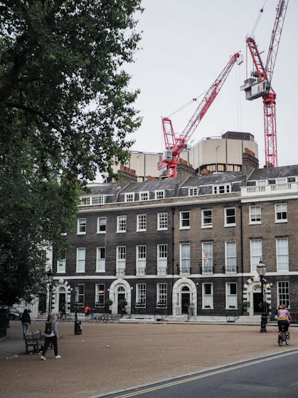 a large brick building with a crane on top of it