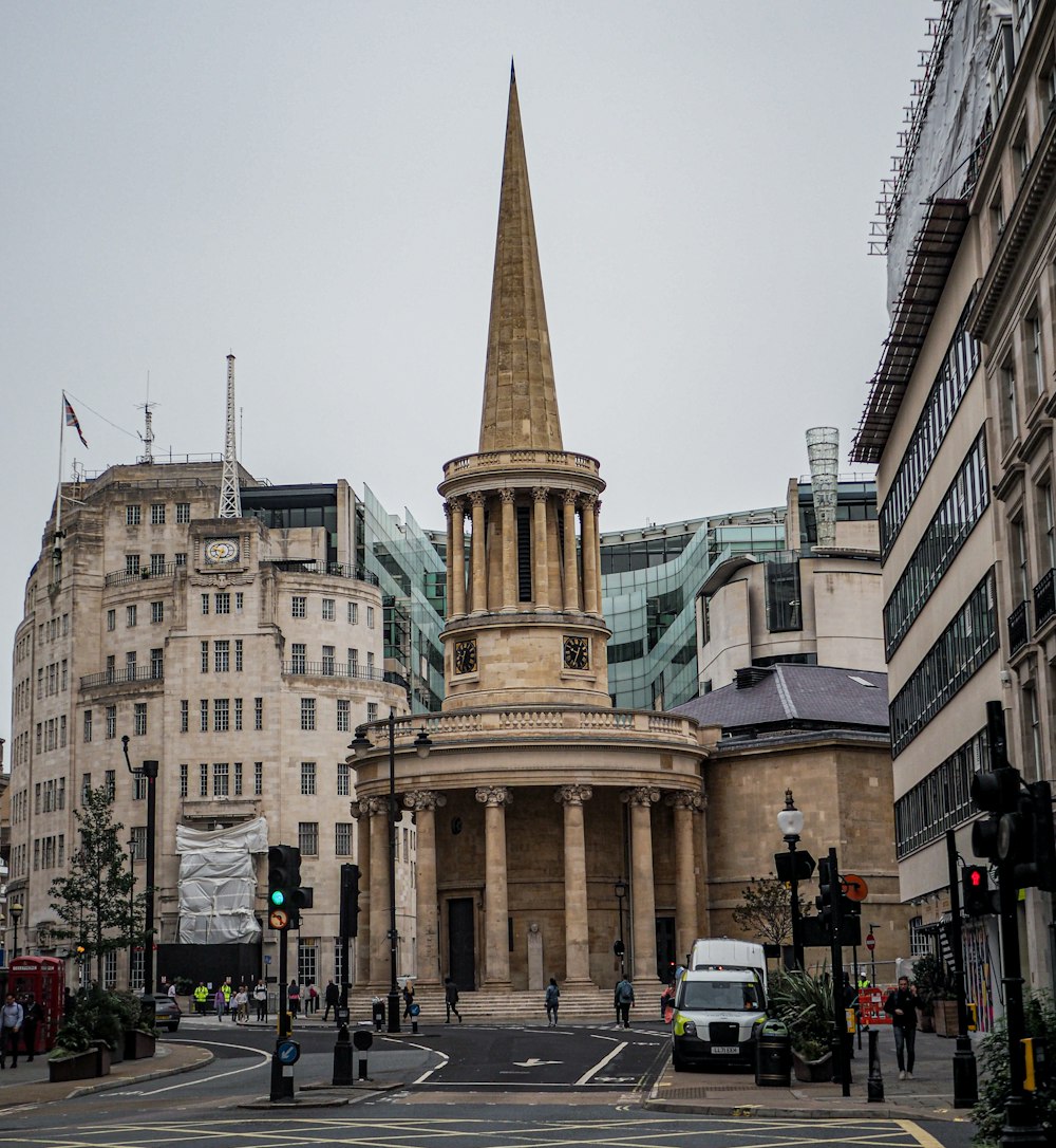 a church with a steeple on a city street