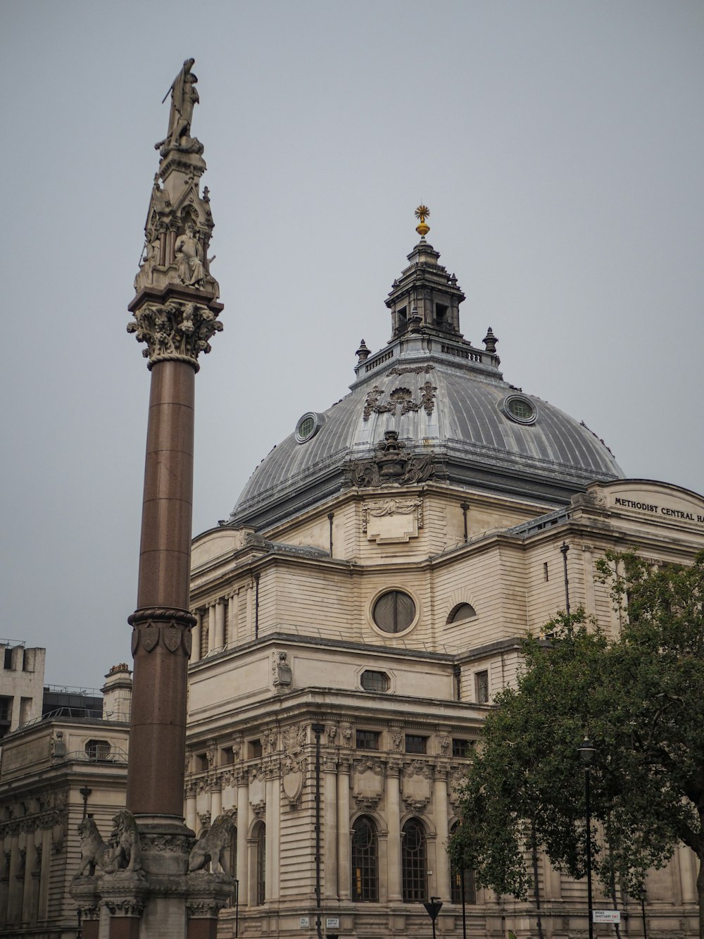 a tall building with a dome on top of it