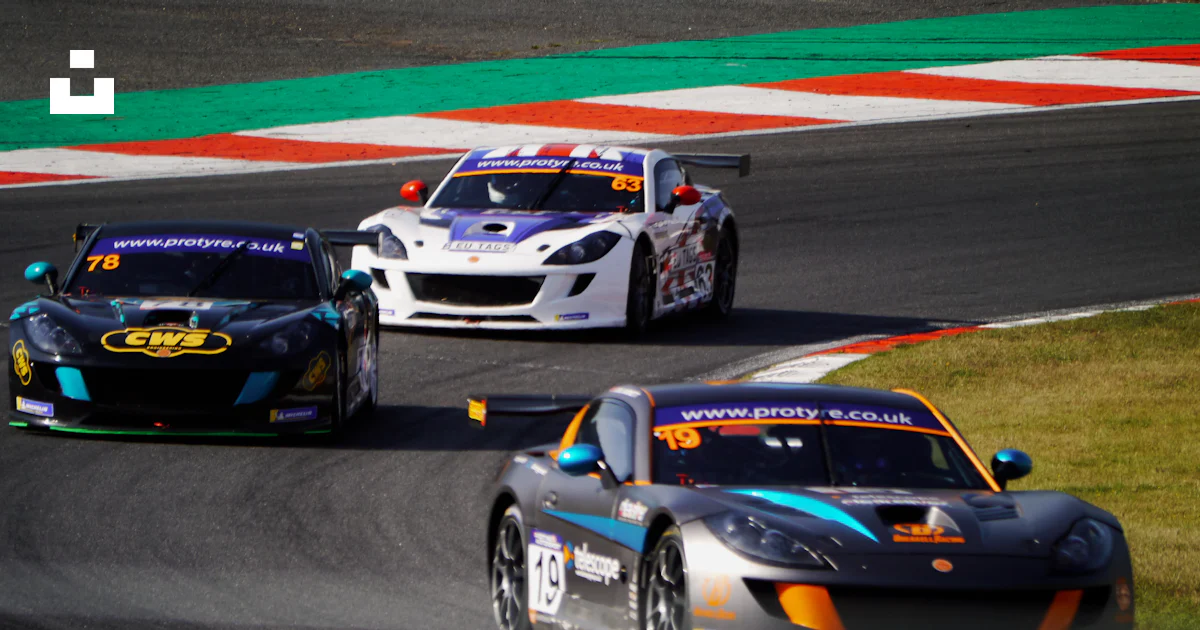 Three race cars racing on a race track photo – Free Longfield Image on ...