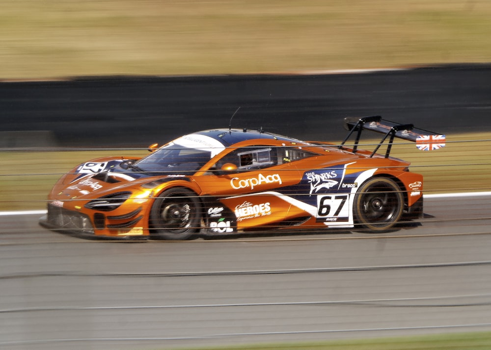 a car driving on a race track with a number on it