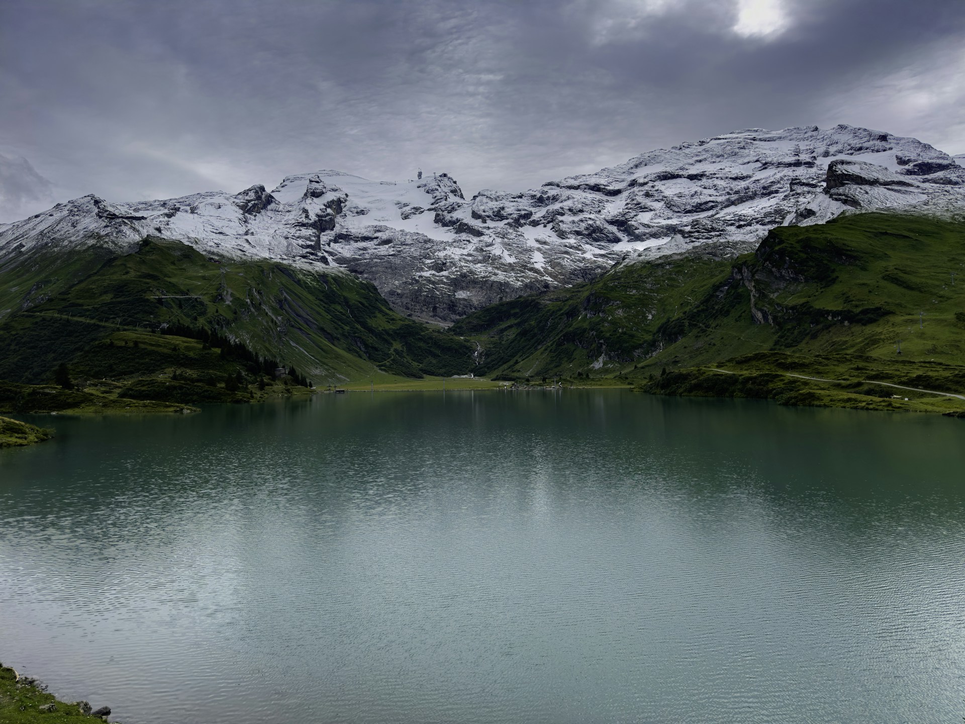 woman wearing yellow long-sleeved dress under white clouds and blue sky during daytime