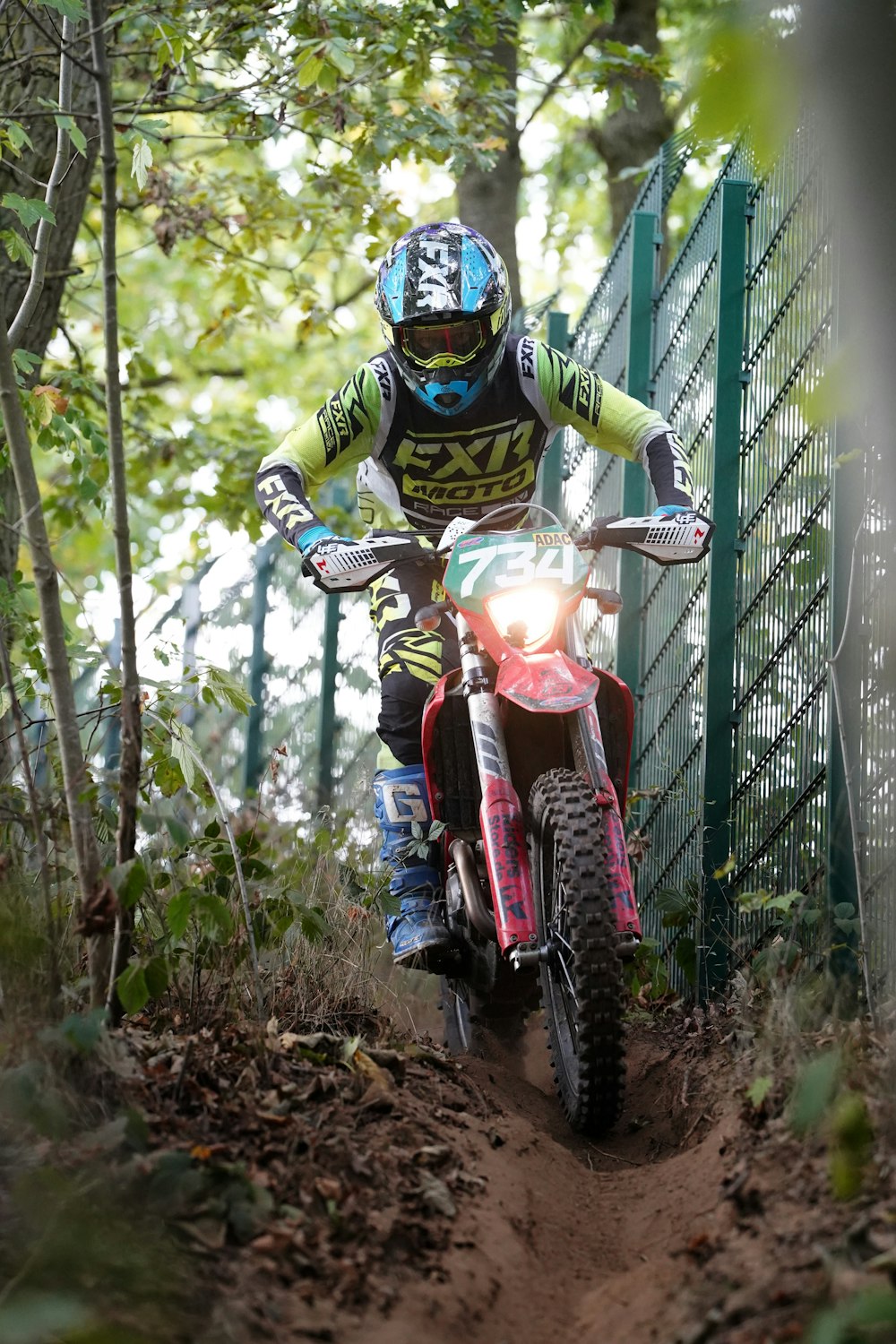 a person riding a dirt bike on a trail