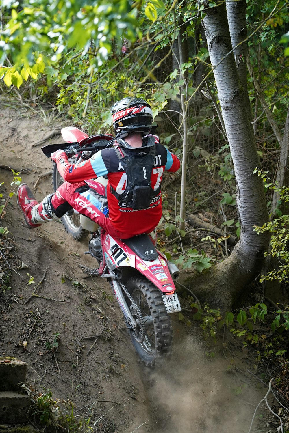 a person riding a dirt bike on a trail