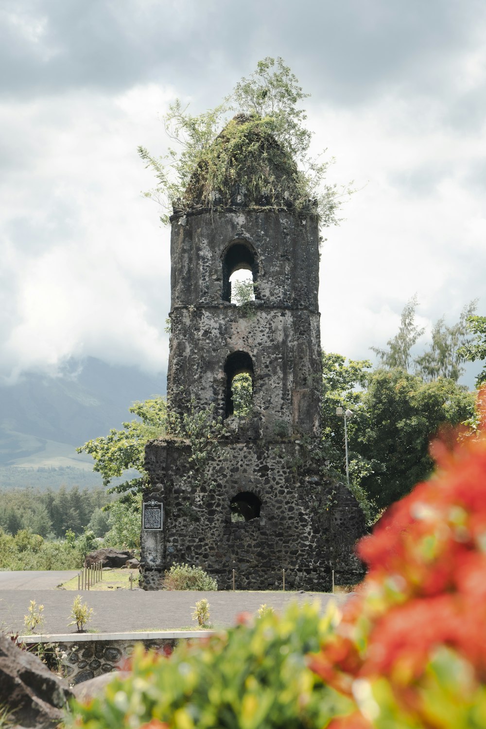 a tall tower with a clock on the top of it