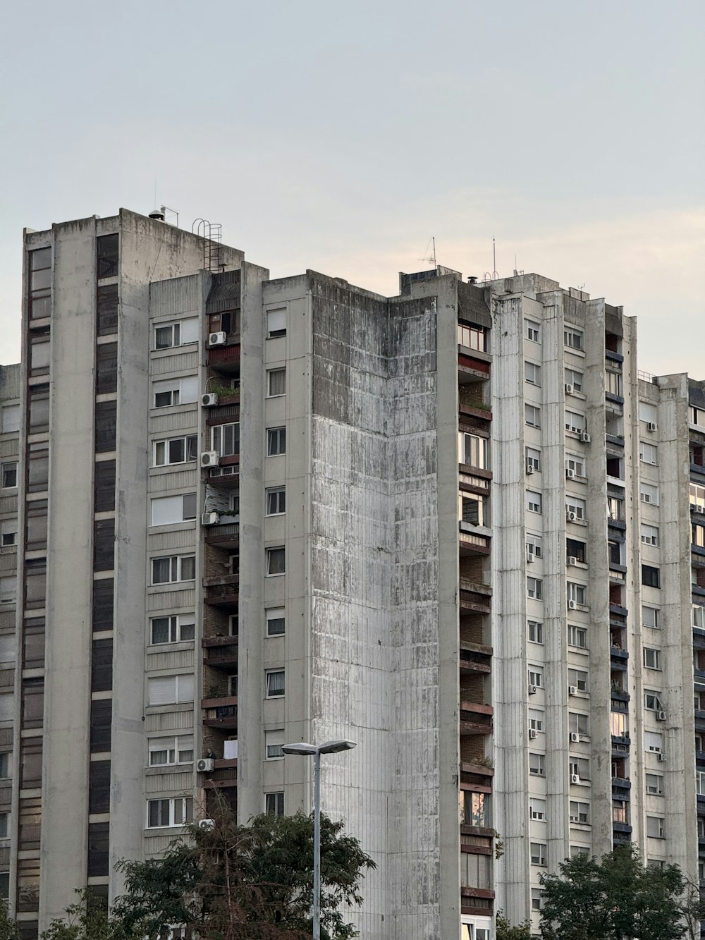 a very tall building with lots of windows and balconies