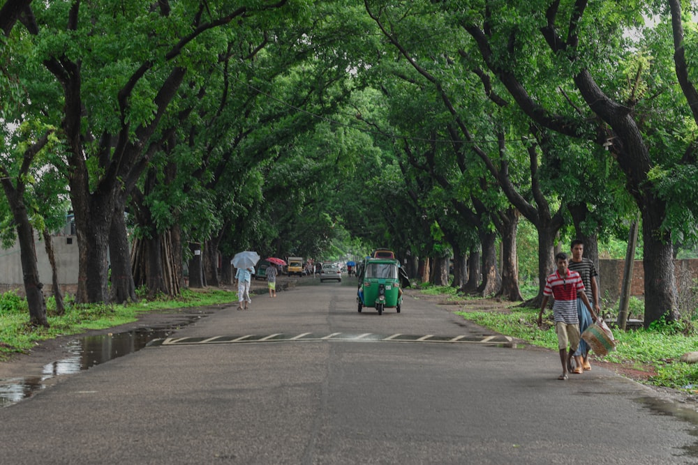 a couple of people walking down a street