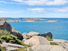 a large body of water surrounded by rocks