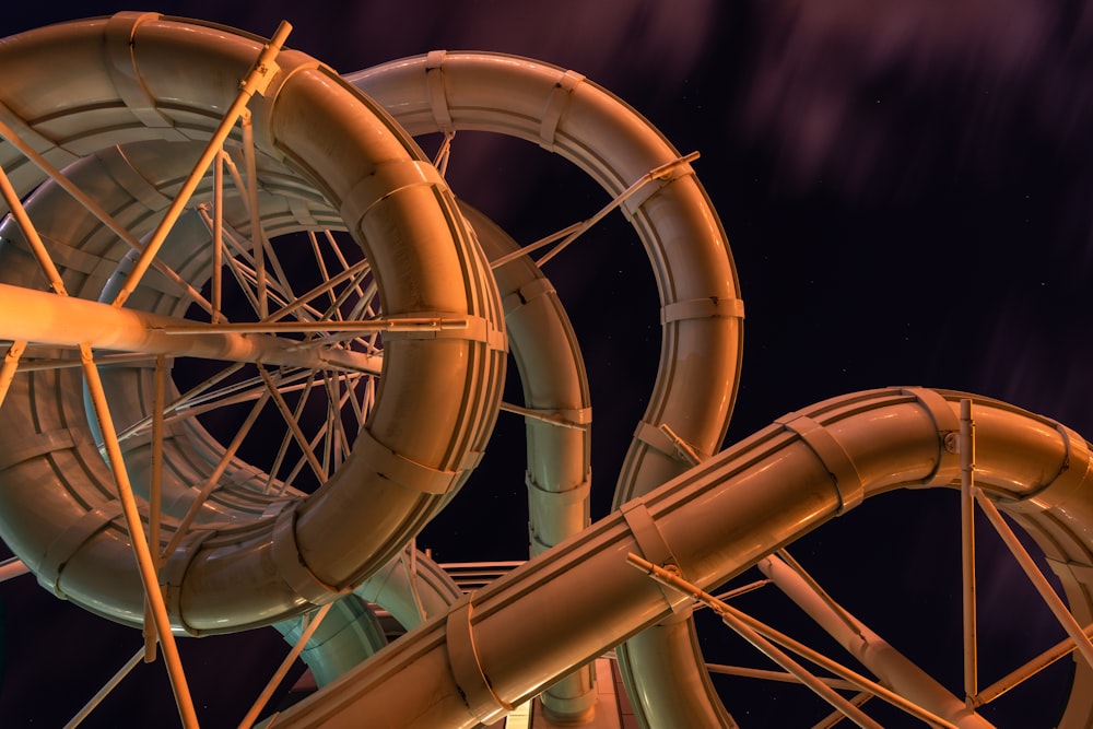 a close up of a water slide at night