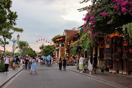 a group of people walking down a street