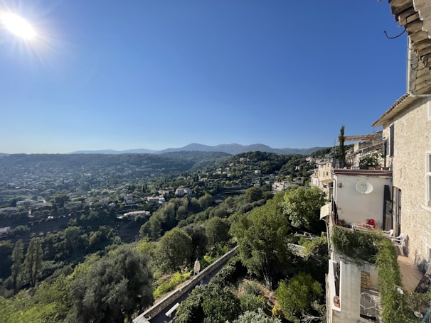 Panoramic view of lush green hills surrounding Residencial Évora at sunrise