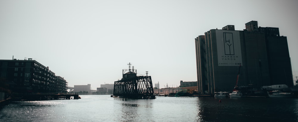 a large body of water with buildings in the background