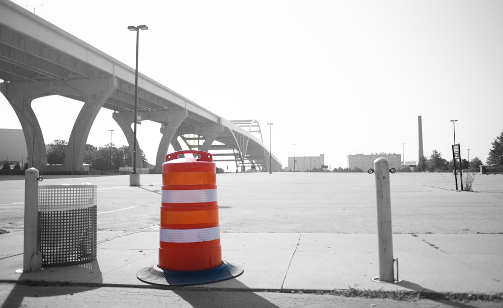 a traffic cone sitting on the side of a road