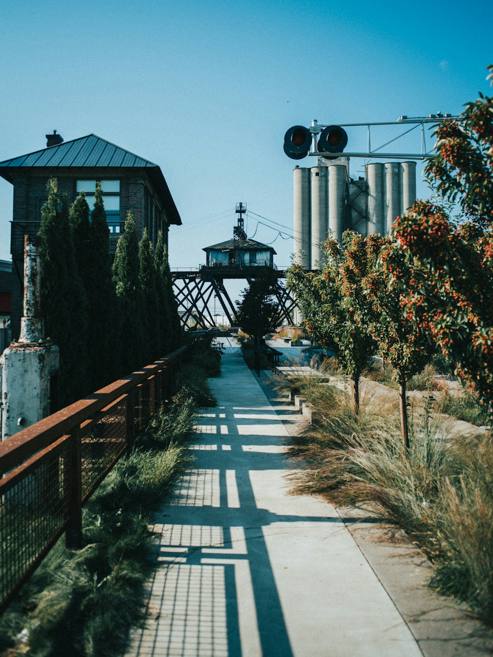 a view of a walkway with a building in the background