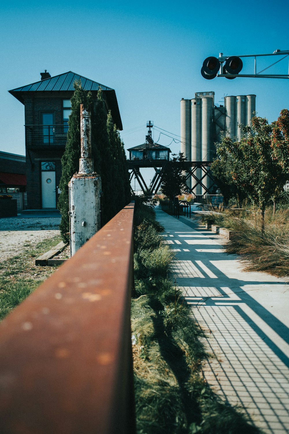 a red rail on the side of a road