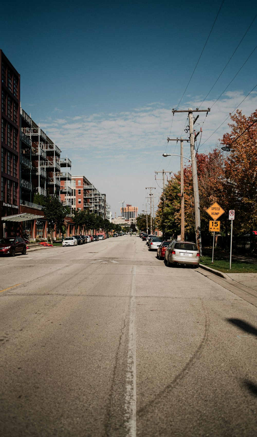 a street with cars parked on both sides of it