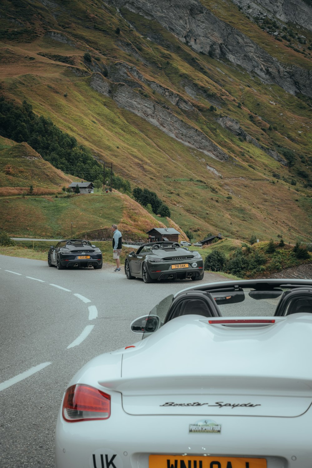 a group of cars parked on the side of a road