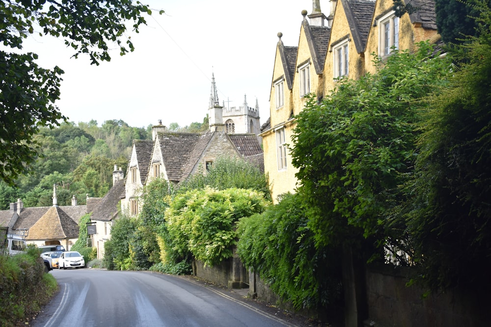 a street lined with houses and trees next to each other