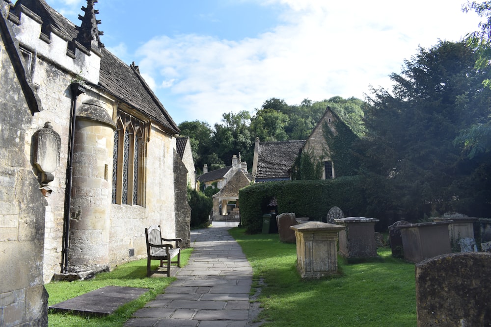 a stone building with a wooden bench in front of it