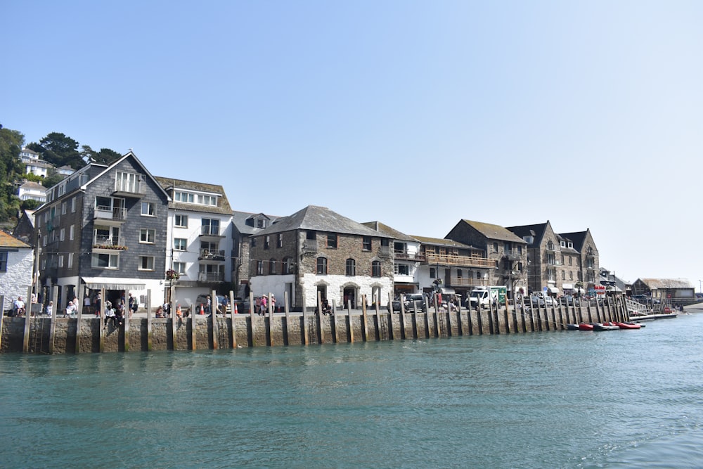 a row of houses next to a body of water