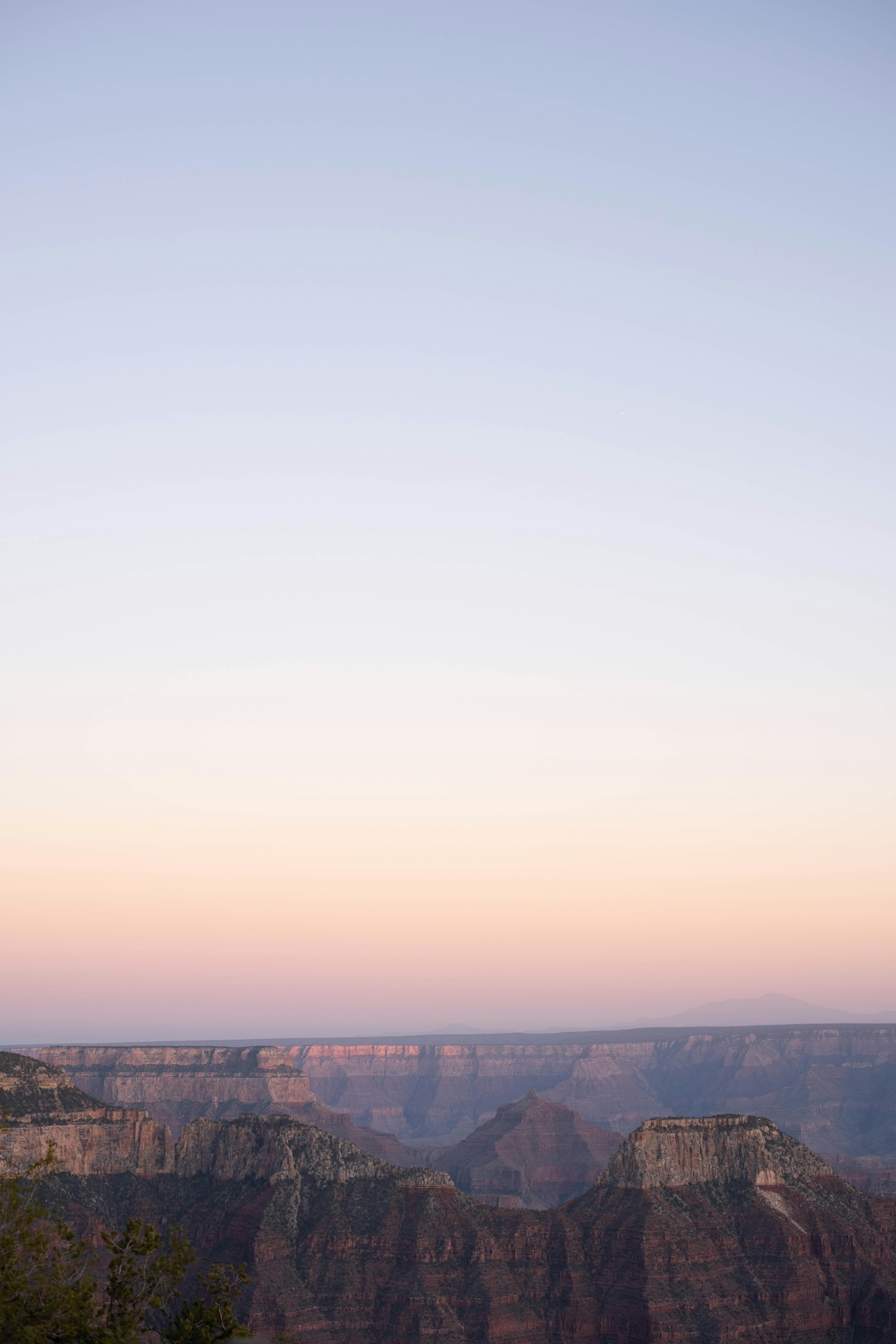 a view of the grand canyon at sunset