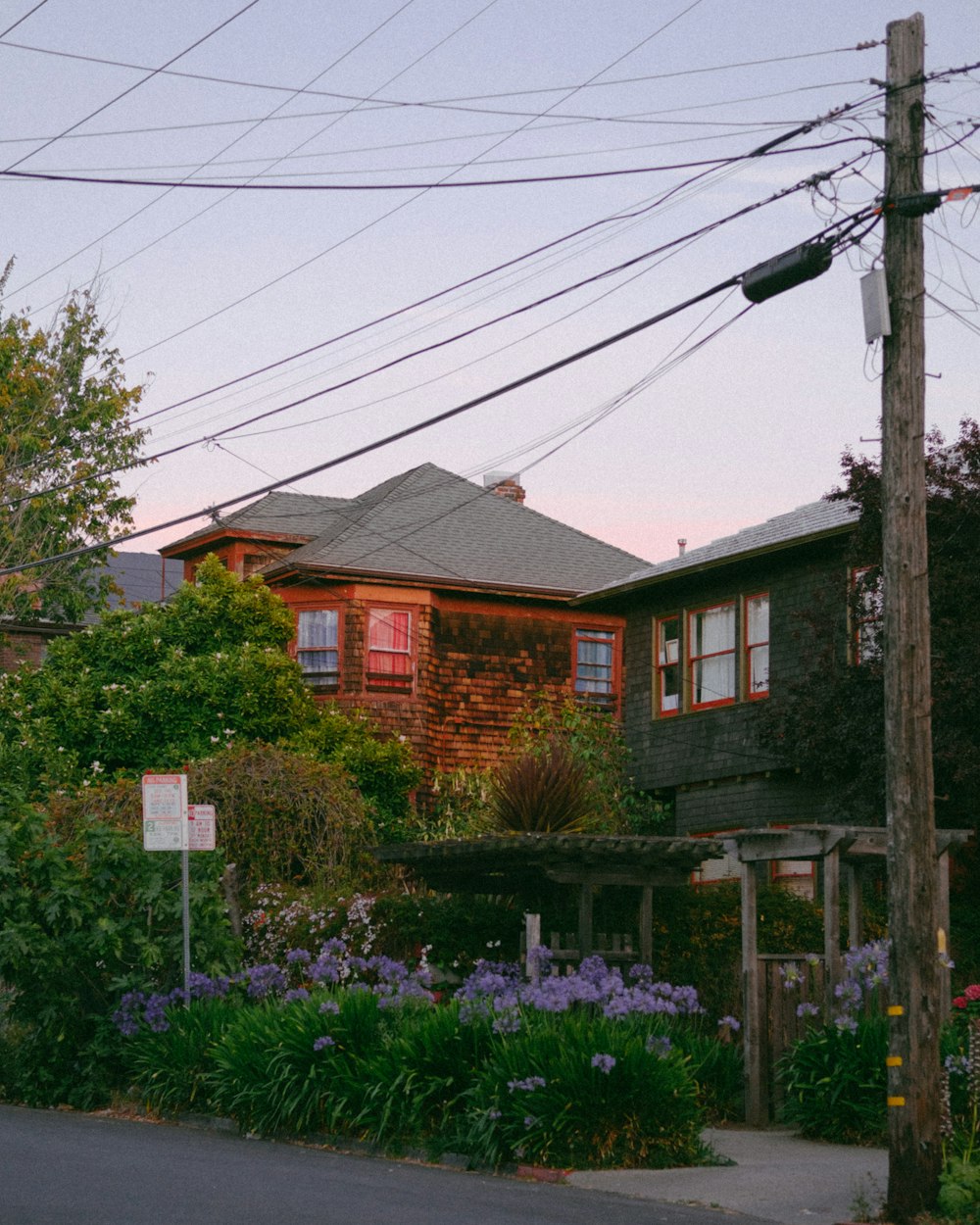 a house with a lot of power lines above it