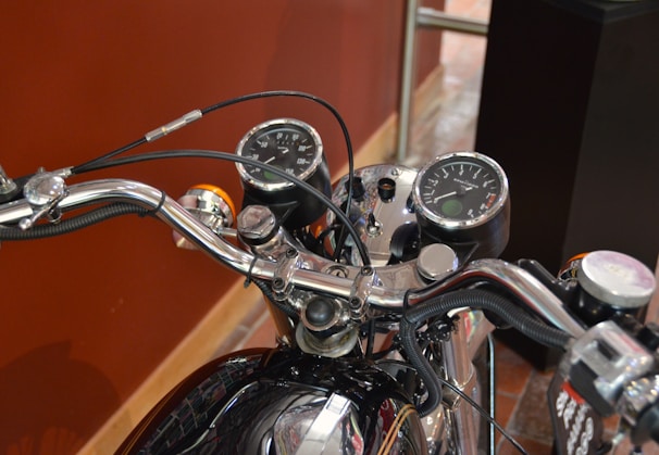 Detailed shot of motorcycle handlebars and dashboard.