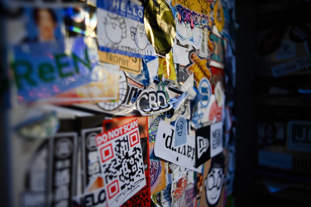 a bunch of stickers are on a wall