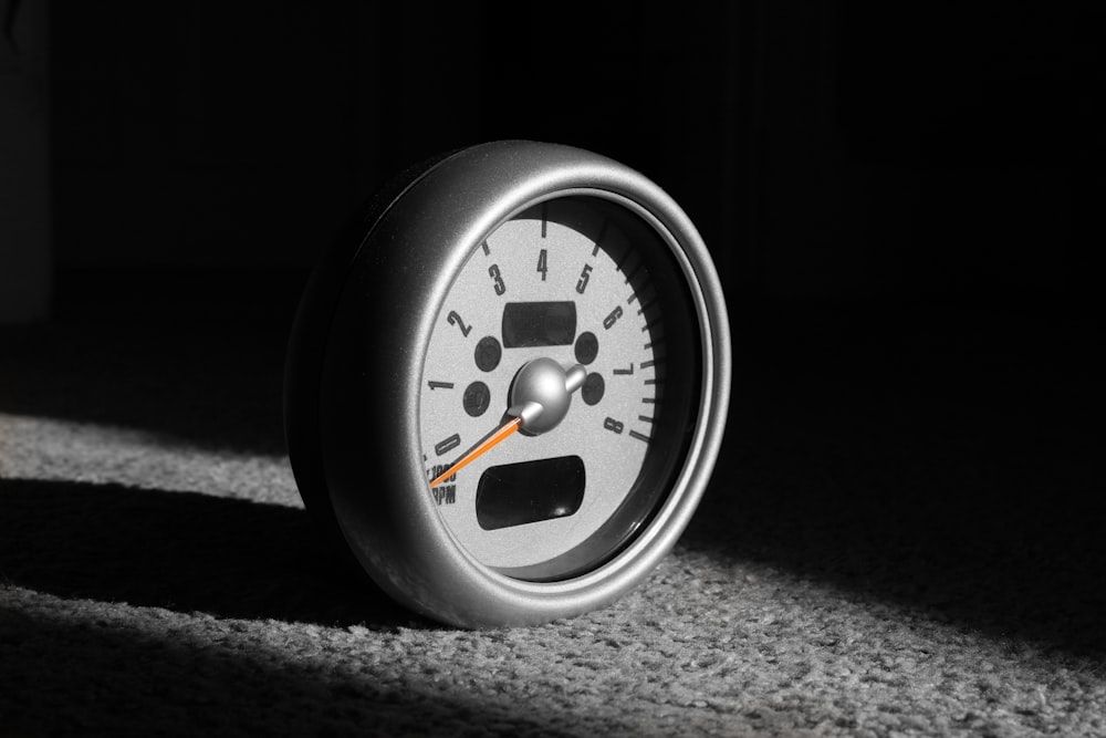 a close up of a speedometer in the dark