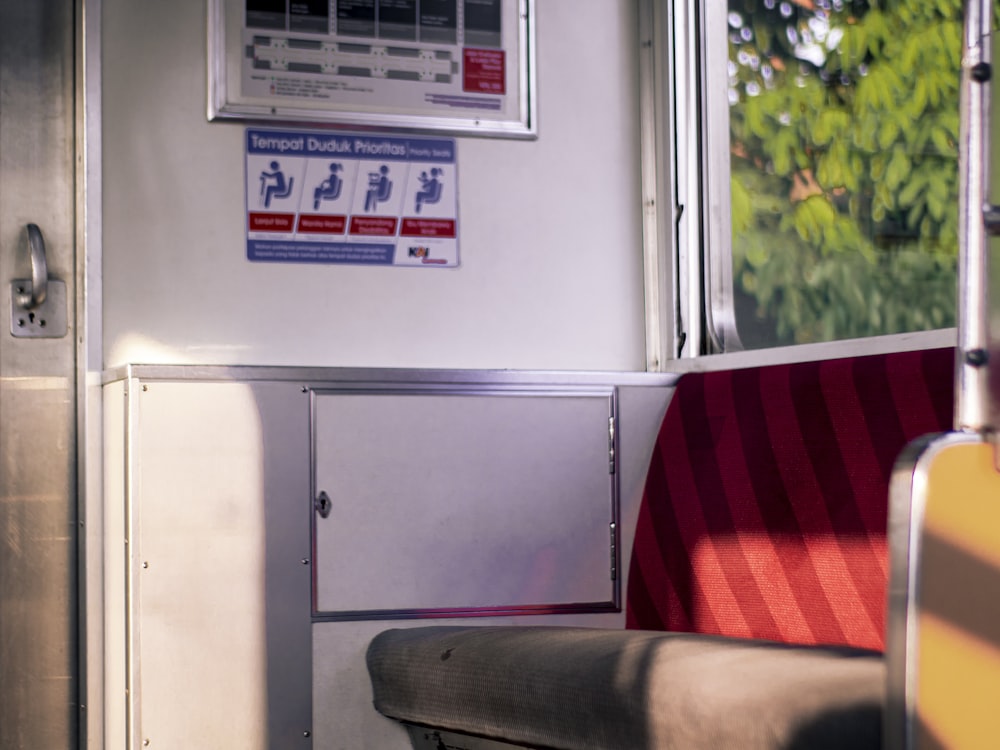 a seat on a train next to a window