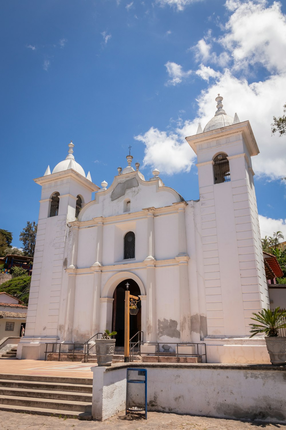 a large white church with a cross on the top of it