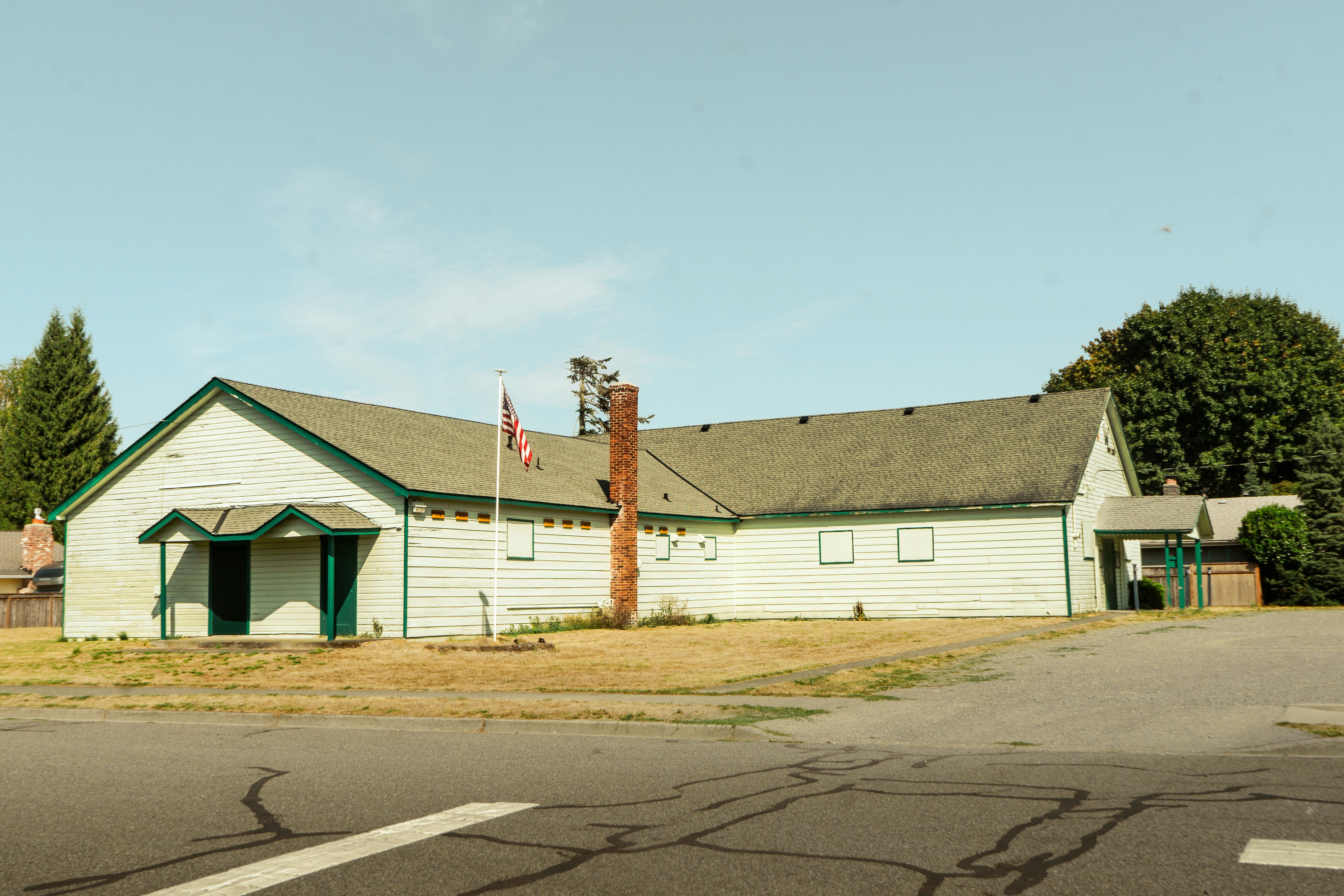 a white building with a flag on top of it