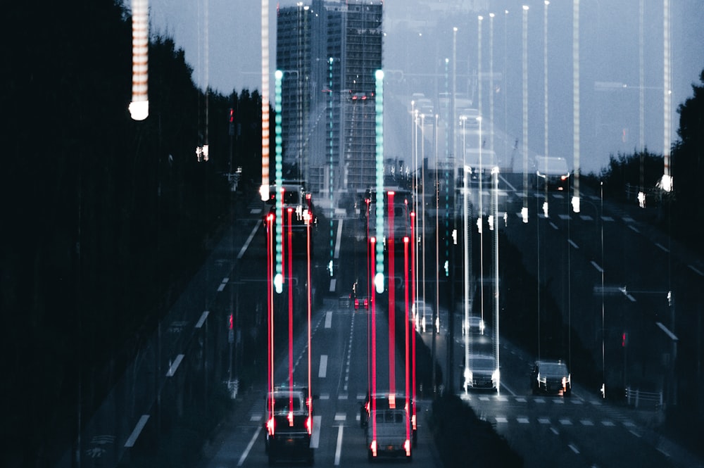 a city street filled with traffic and tall buildings