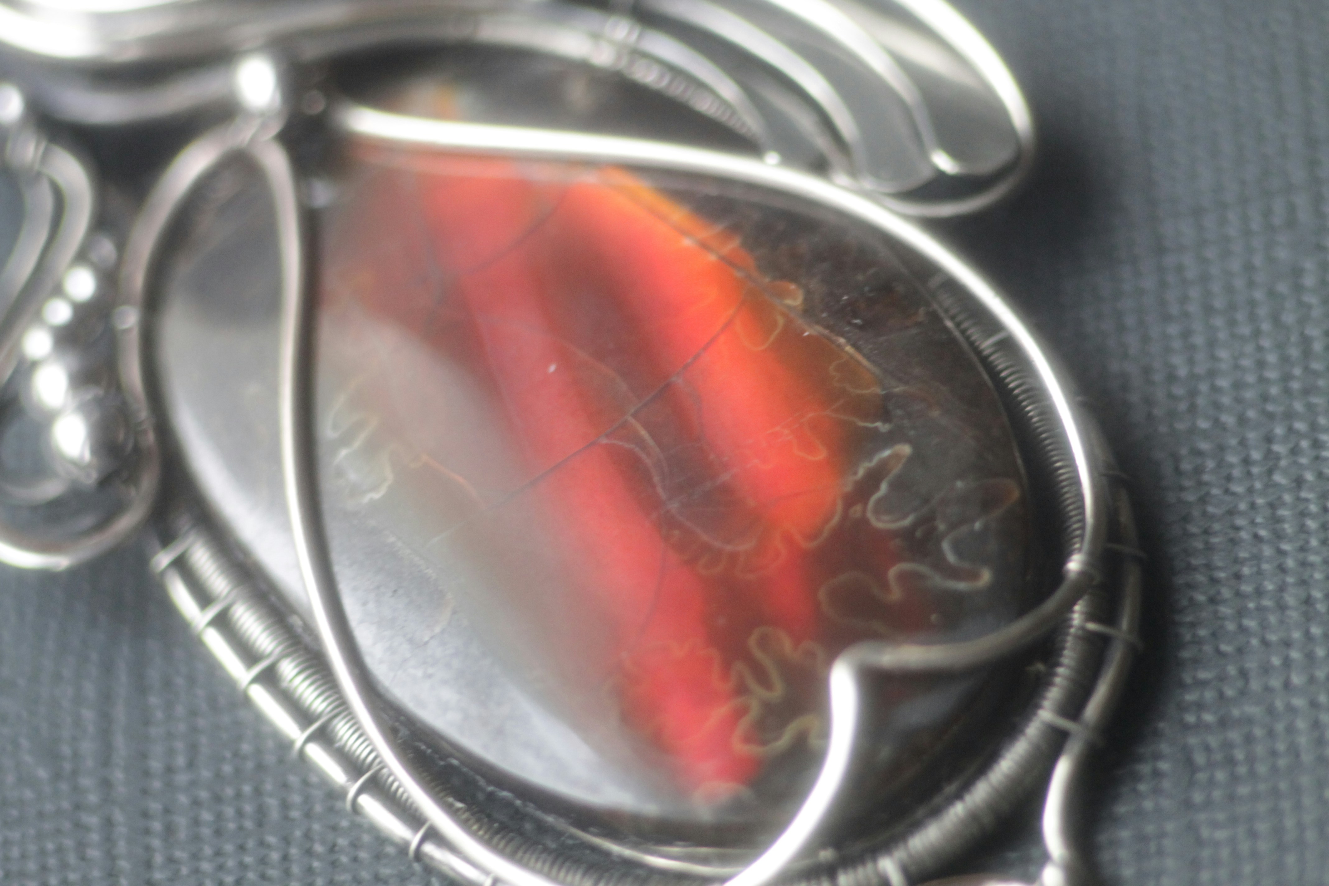 Close-up of sacred gold pendant being polished by skilled artisan, devotional jewellery craft