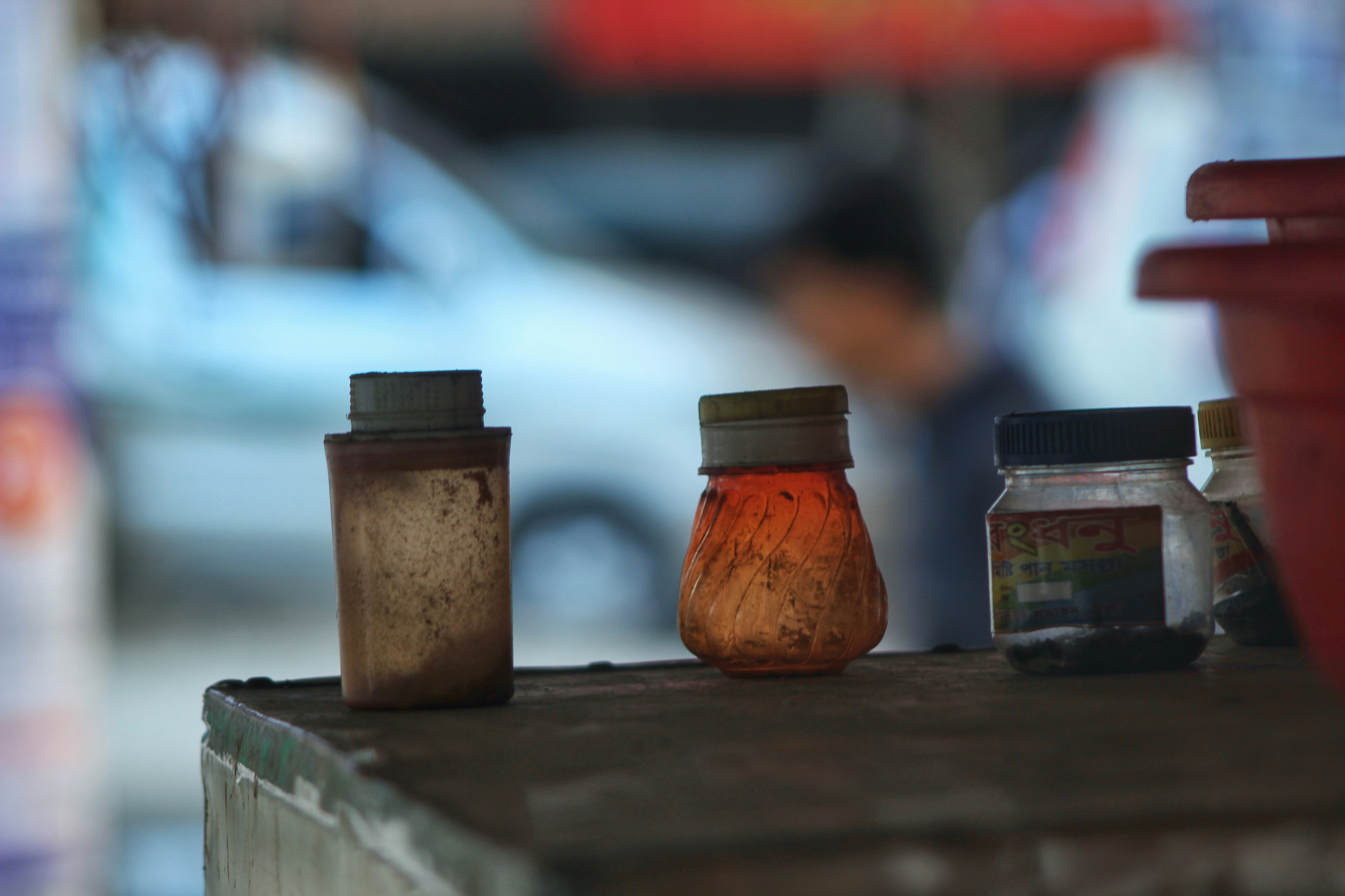a couple of jars sitting on top of a wooden table
