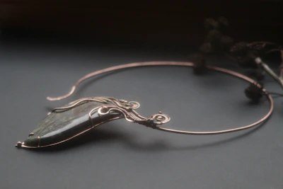 Model wearing a beautifully crafted necklace that highlights its unique design.
