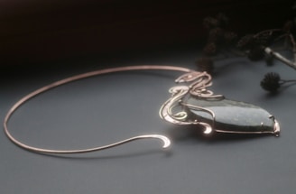 Elegant copper necklace with a deep green malachite pendant.