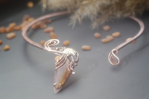 An elegant handcrafted necklace featuring a radiant gemstone.