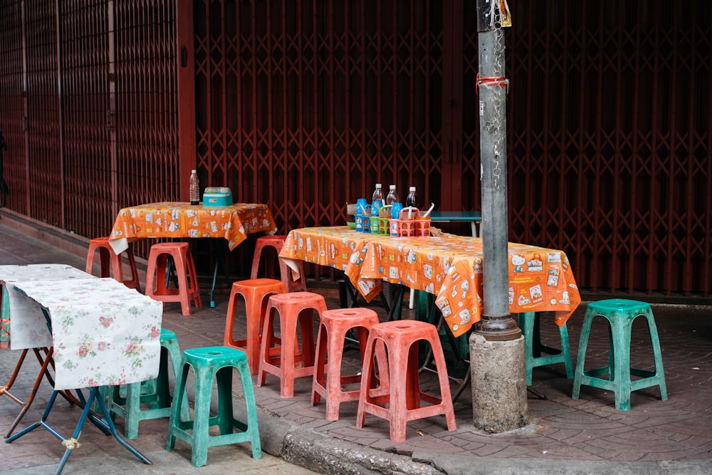 a number of tables and chairs near one another